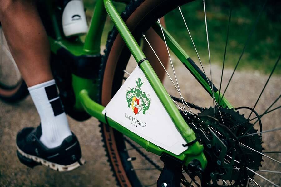 A rear wheel of an e-bike with the logo of the Hotel Trattlerhof.