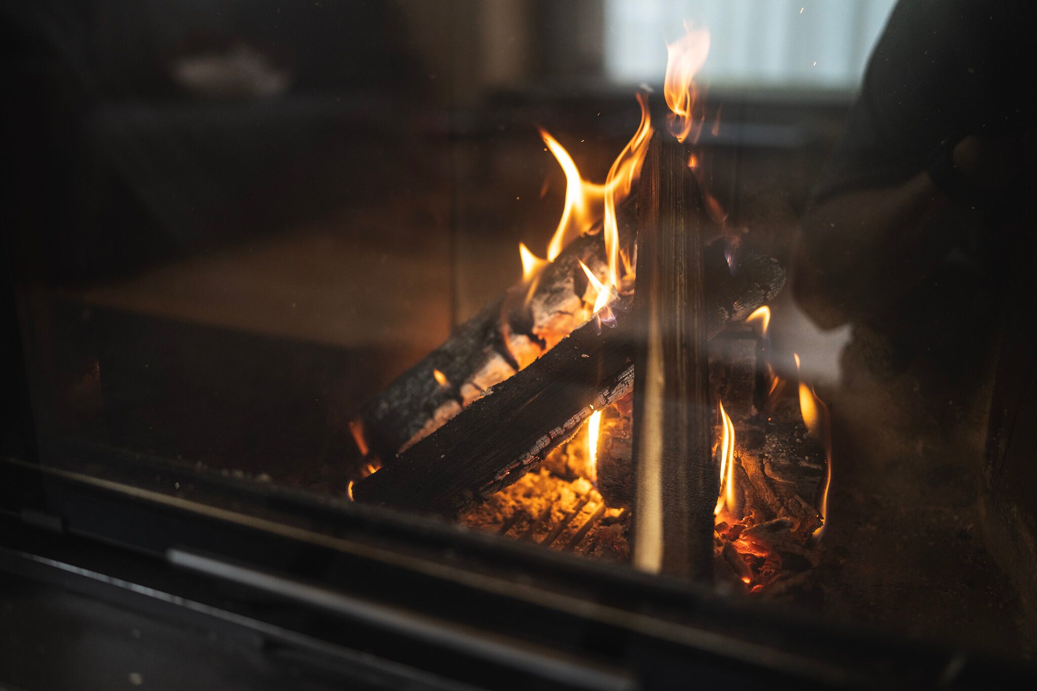 A small campfire in a fireplace