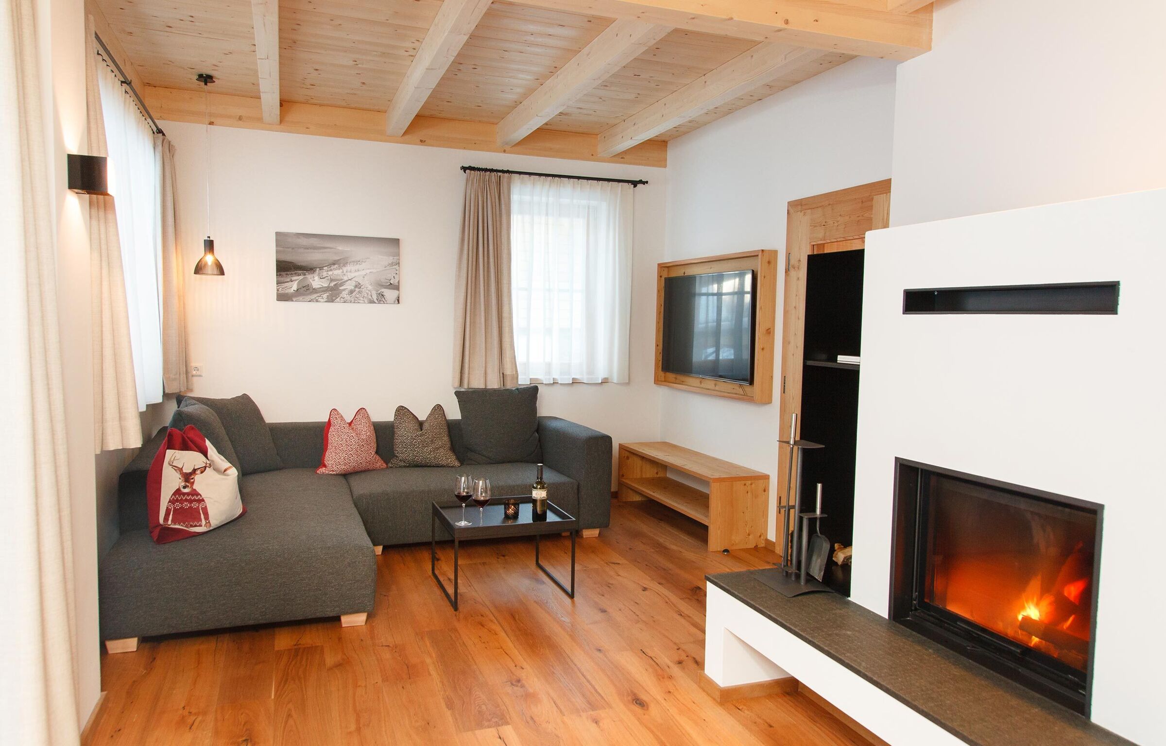 Living room in the chalet with a fireplace in Bad Kleinkirchheim