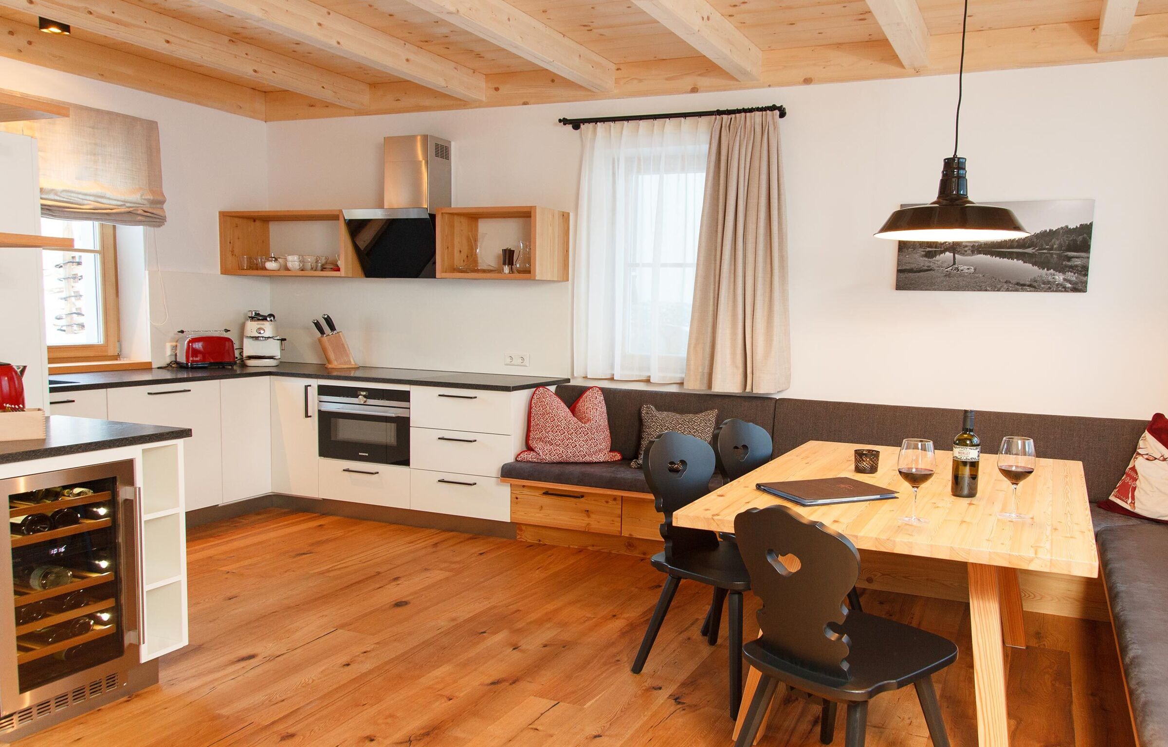 Modern and large kitchen and dining area in the Trattlers Hof chalets in Carinthia