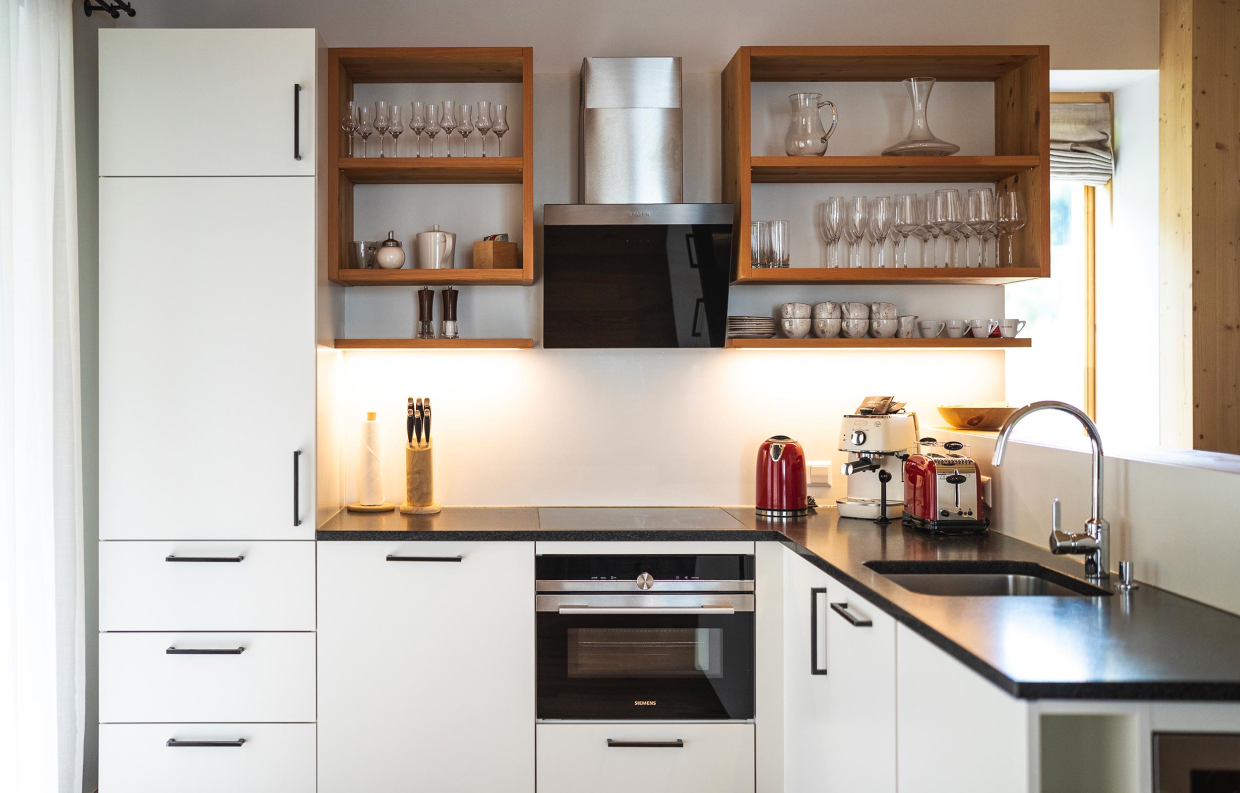 A modern fully equipped kitchen at Trattlers Hof - Chalets in Carinthia.